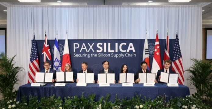 India Joins US-Led Pax Silica Alliance Next Month in Strategic Shift Official announcement being made at a Washington policy institute podium with American flag backdrop.
